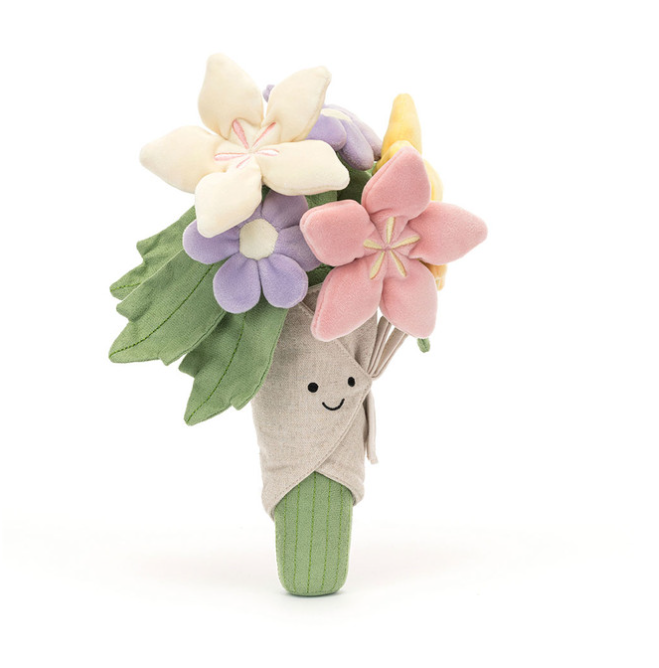 Plush toy resembling a bouquet of flowers with a smiling face on a white background
