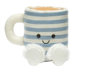 Striped mug with a smiley face and white fuzzy slippers on a white background