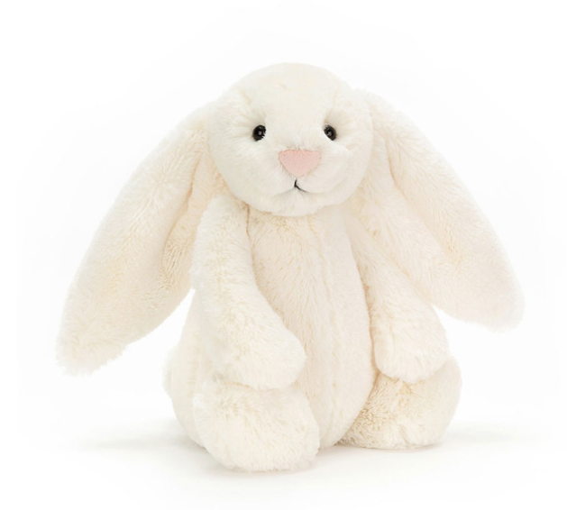 White plush bunny toy on a white background
