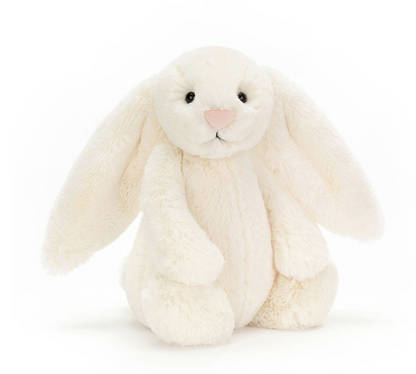 White plush bunny toy on a white background