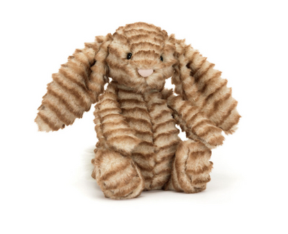 Stuffed animal toy with wavy pattern on a white background